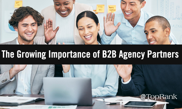 The growing importance of B2B agency partners group of marketers waving at video call image