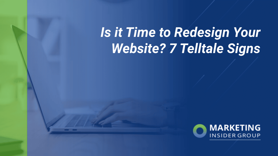 woman on a computer looking at seven telltale signs that it's time to redesign your website