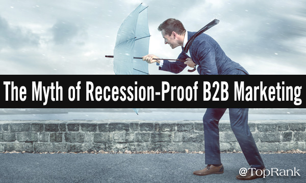 The myth of recession-proof B2B marketing businessman holding umbrella against headwinds image